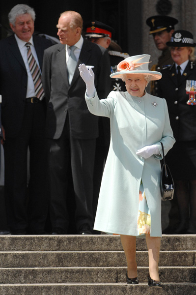 Queen Elizabeth II waves to the crowds as she leaves the National Museum of Wales in Cardiff, 2007