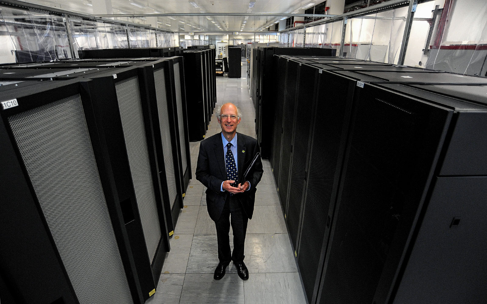 Prof. Brian Golding - Deputy Director of Weather Science at the Met Office, with the IBM P6 supercomputer