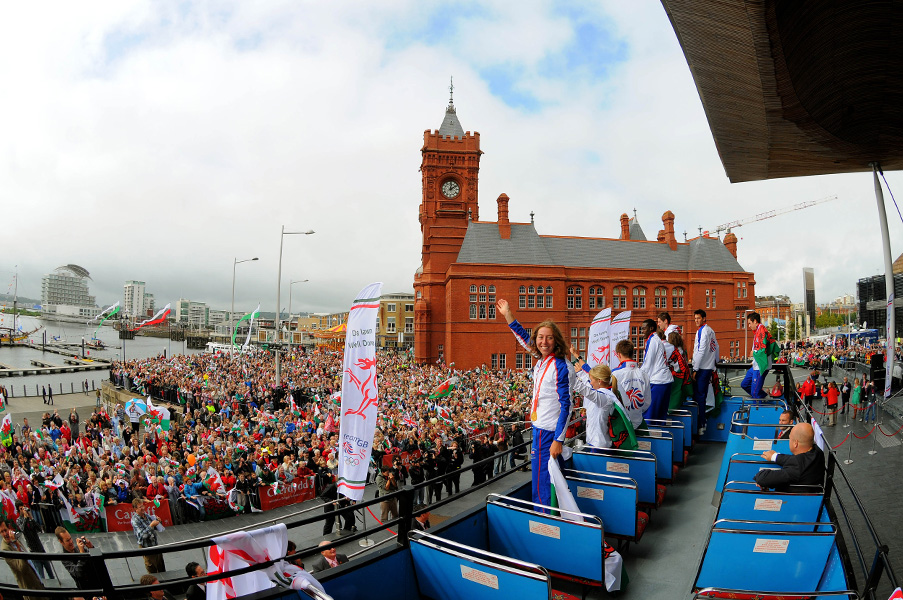 Thousands of people gather outside the Senedd (Welsh Assembly) in Cardiff Bay to greet the Welsh Athletes returning from the Beijing Olympic games with an open-top bus tour, 2008