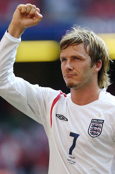 England Captain David Beckham salutes the crowd as he leaves the Millennium Stadium pitch after his side beat the Welsh, 2005